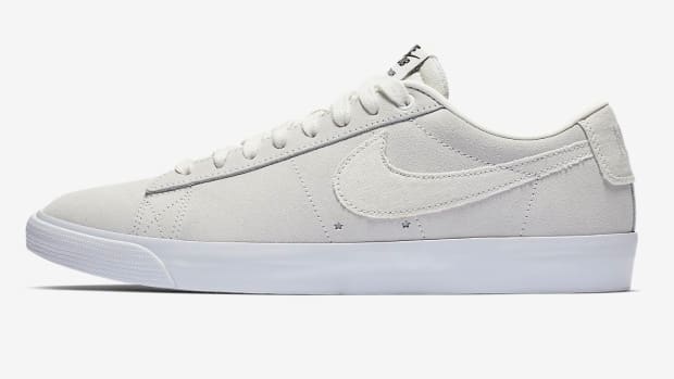 View of off-white colored Nike skate shoes.
